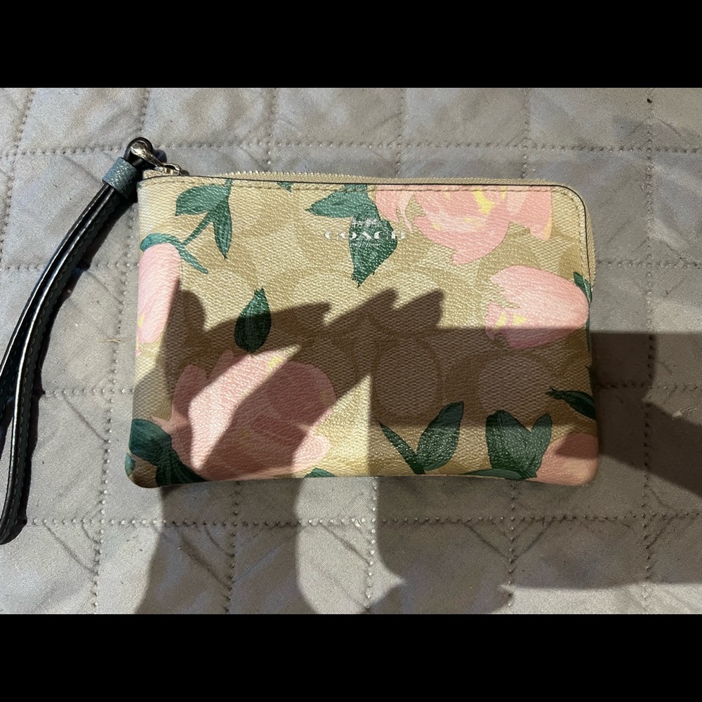 Beautiful Coach wristlet in beige and pink. Gently used.